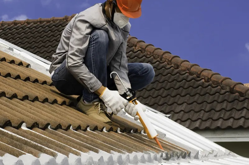 Roofer repairing a metal roof as part of roofing restoration services in Melbourne