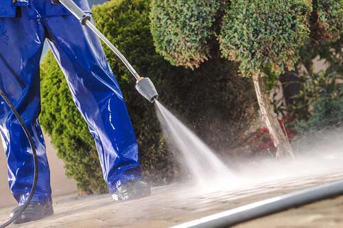 Pressure washing a driveway
